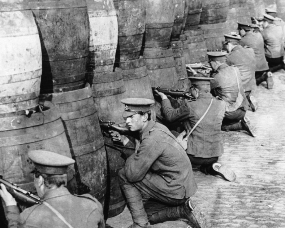 British soldiers sniping from behind a barricade of empty beer casks near the quays in Dublin during the 1916 Easter Rising. (Hulton Archive/Getty Images)
