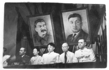Kim Il-sung and Kim Tu-bong at the joint meeting of the New People’s Party and the Workers’ Party of Korea in Pyongyang, 1946. Public Domain.